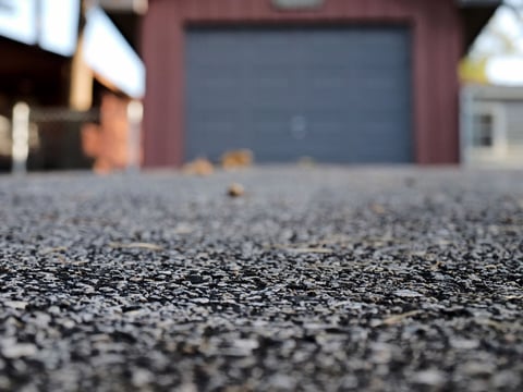 Asphalt driveway to garage